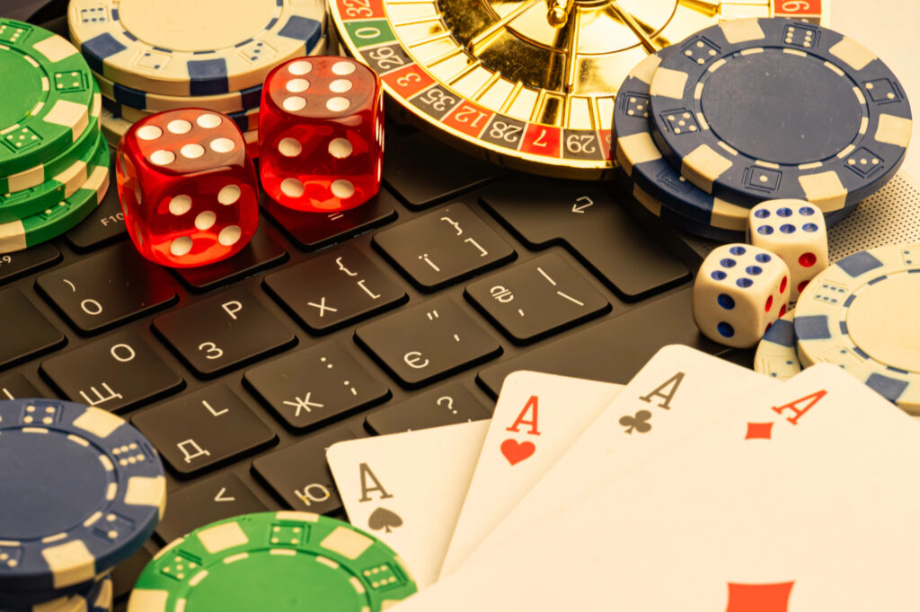Casino gaming elements with poker chips cards and roulette